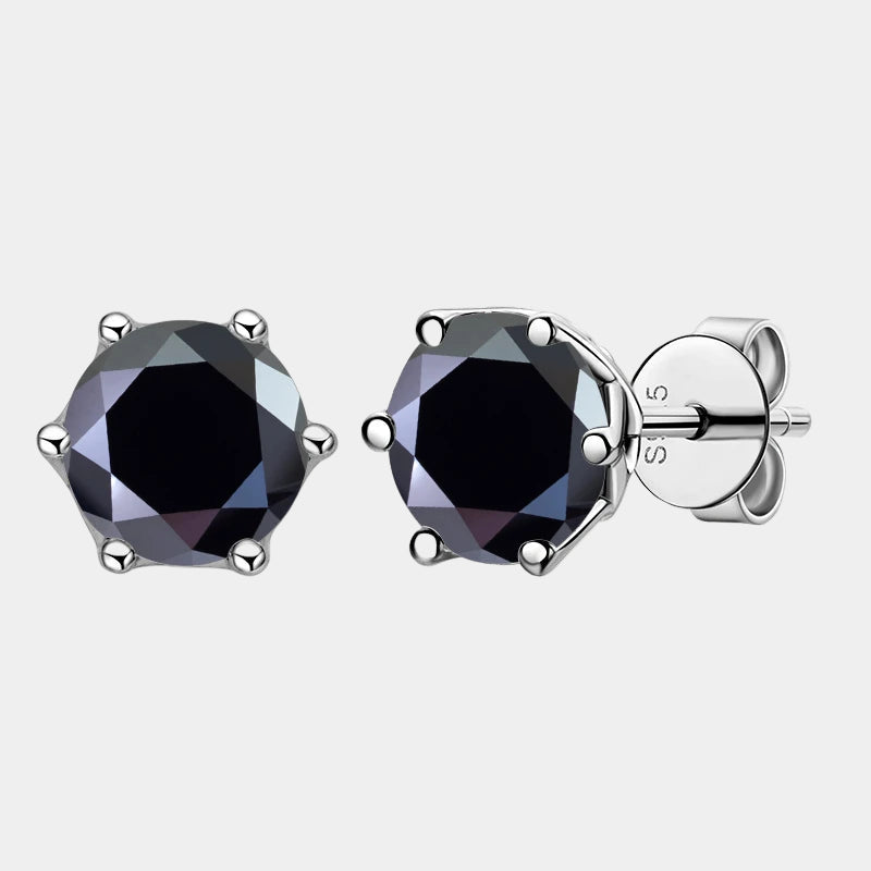 Black gemstone stud earrings with silver setting on a white background