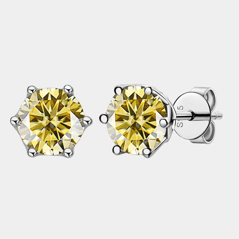Pair of yellow gemstone stud earrings on a white background