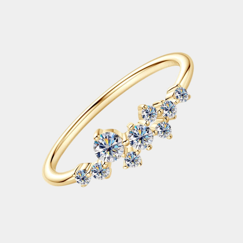 Gold ring with blue gemstones on a white background
