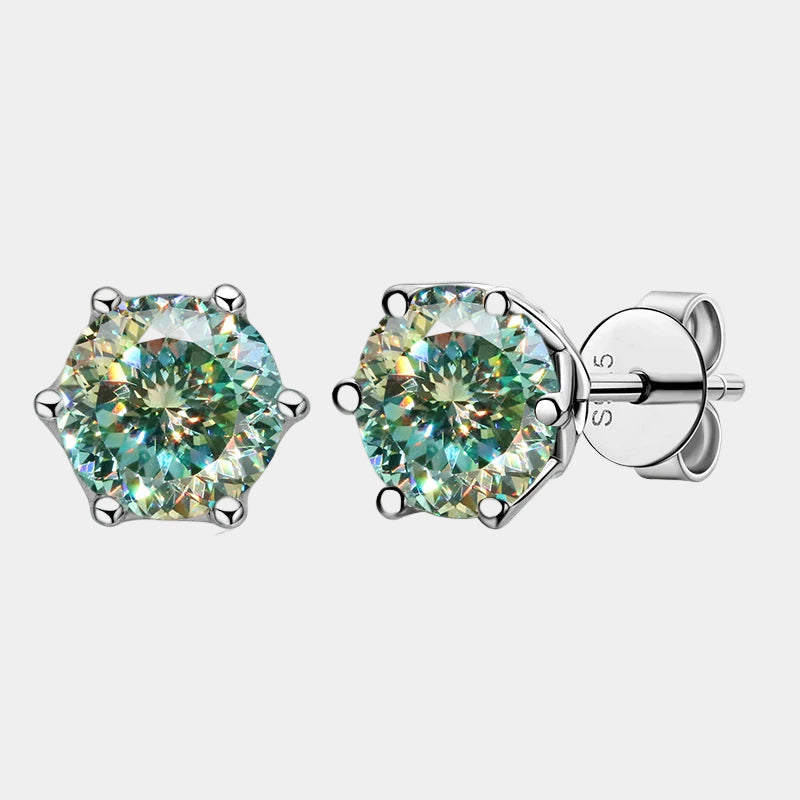 Pair of green gemstone stud earrings on a white background