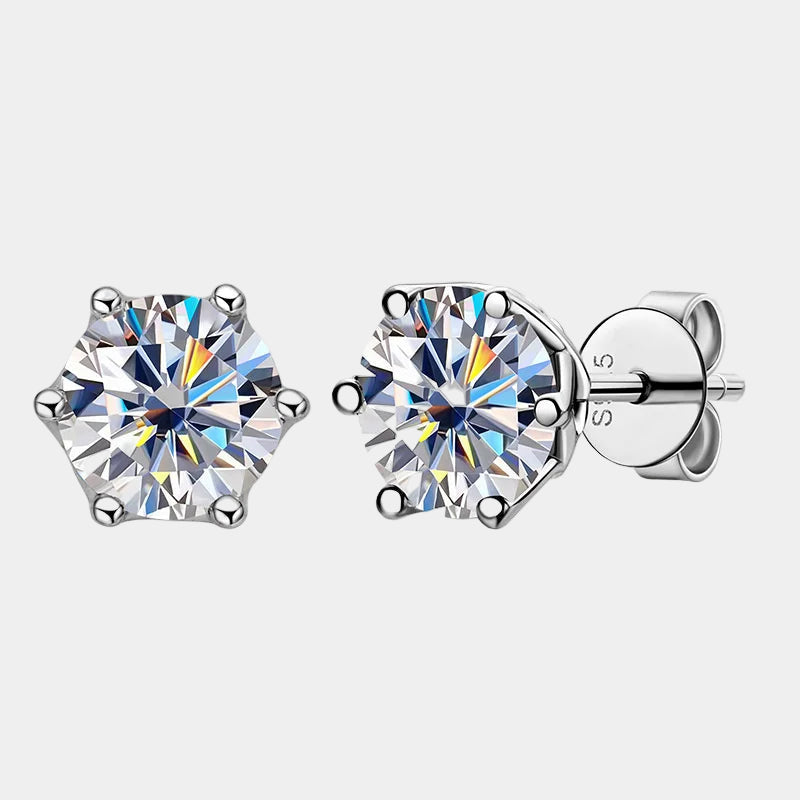 Pair of diamond stud earrings on a white background