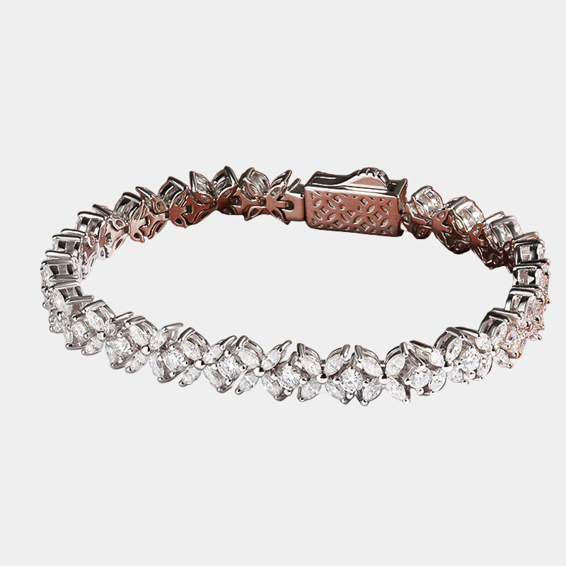 Silver bracelet with diamond-like stones on a magazine page