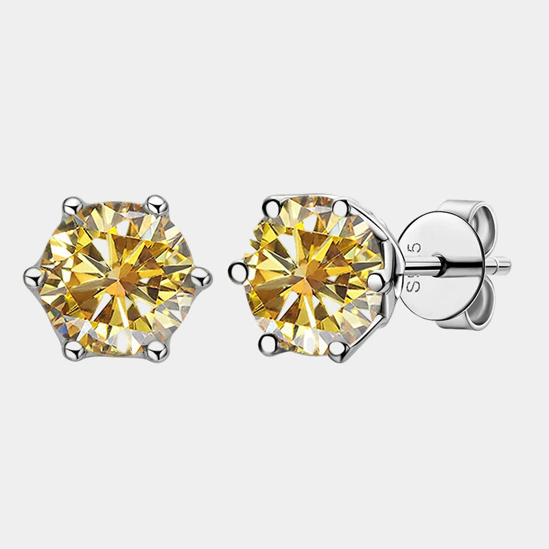 Pair of yellow gemstone stud earrings on a white background