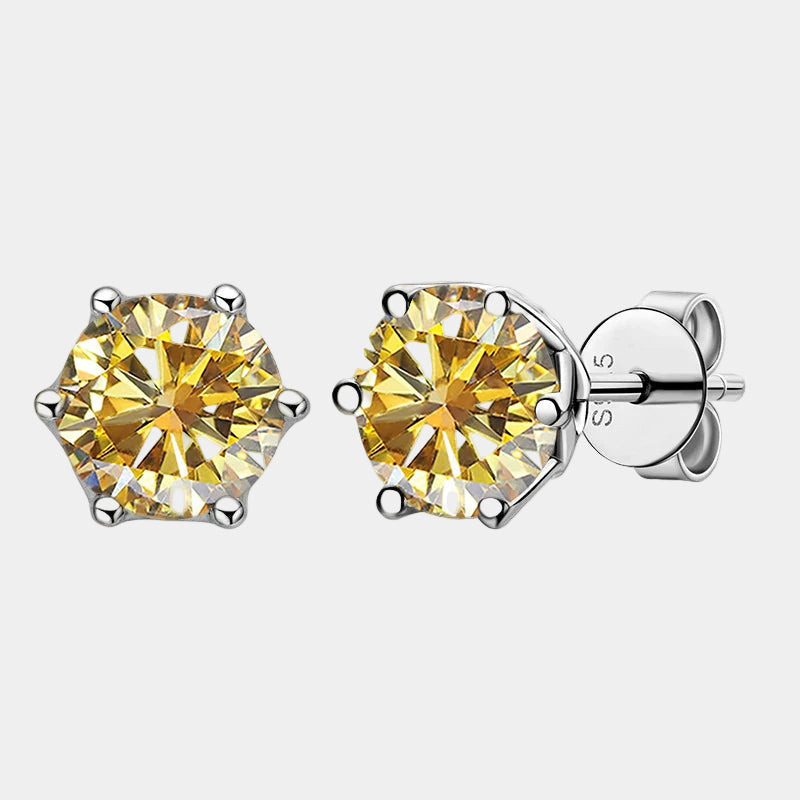 Pair of yellow gemstone stud earrings on a white background