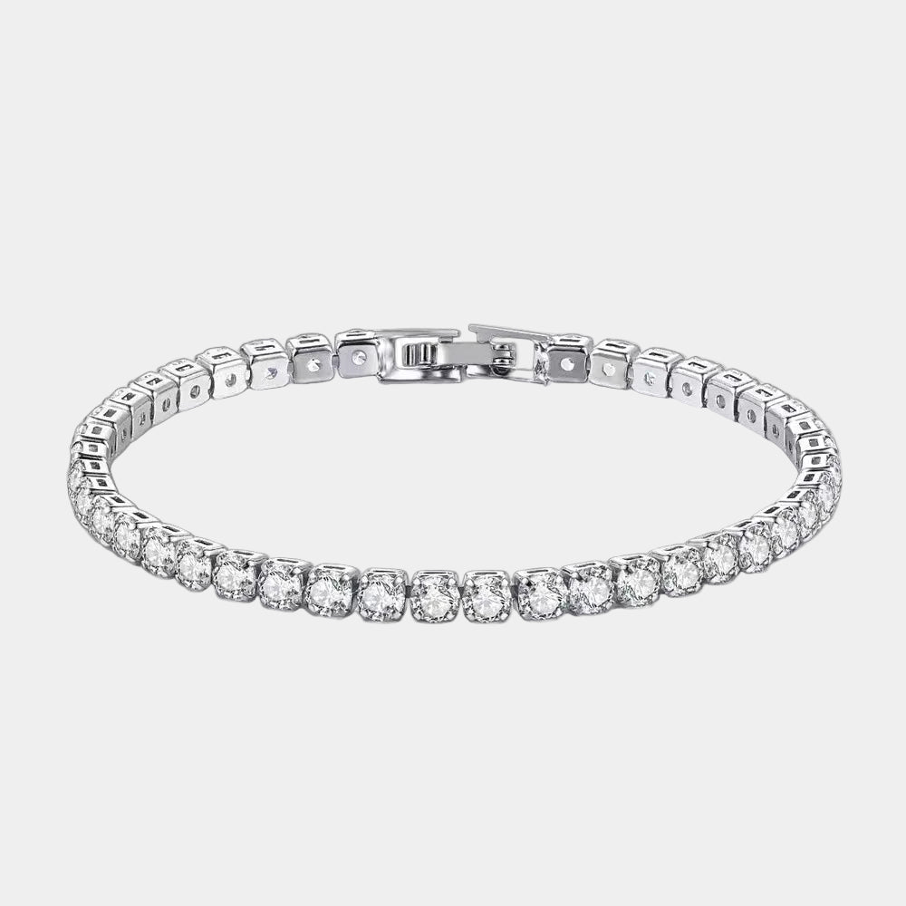Silver bracelet with clear gemstones on a light gray background