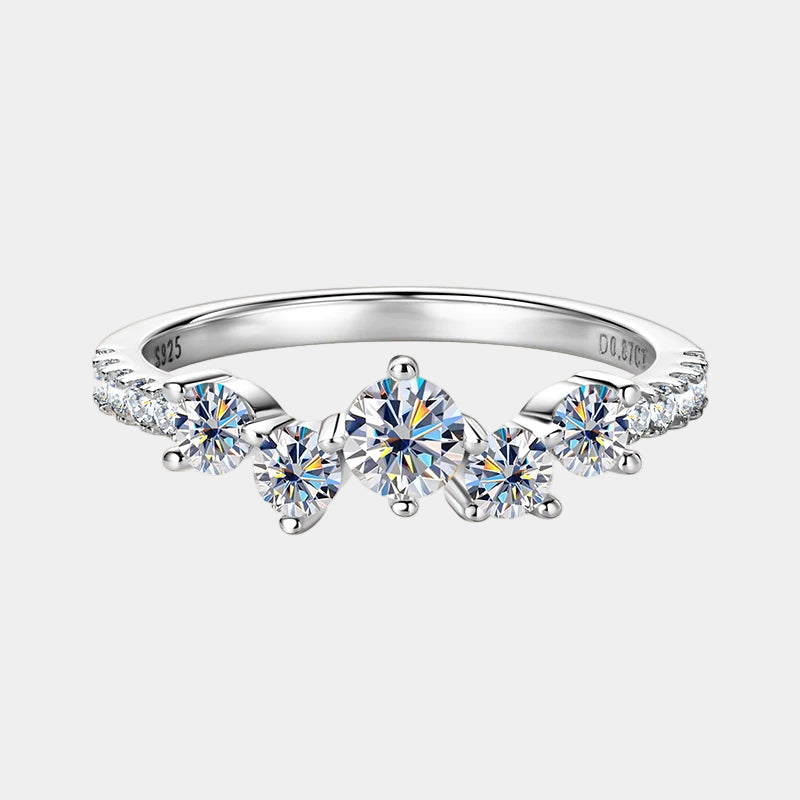 Silver ring with multiple diamonds on a white background