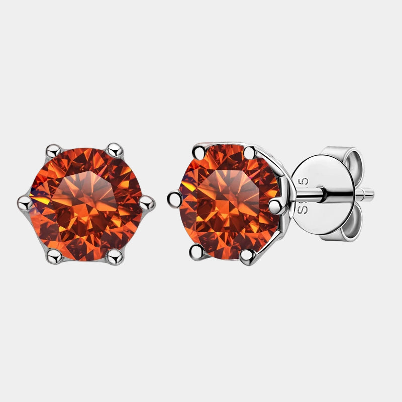 Orange gemstone stud earrings with silver setting on a white background