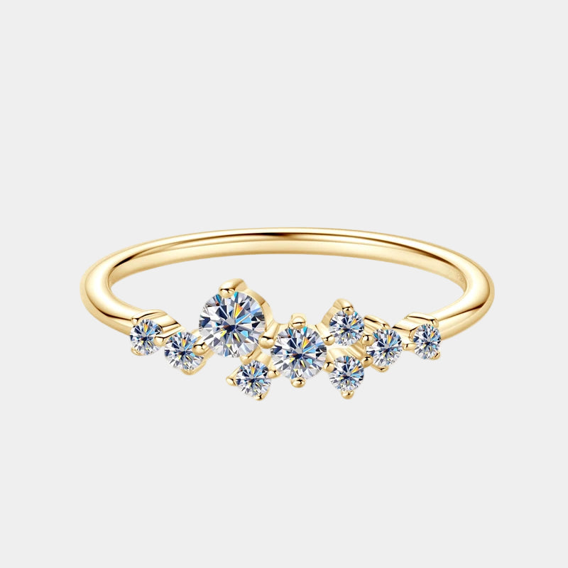 Gold ring with blue gemstones on a white background