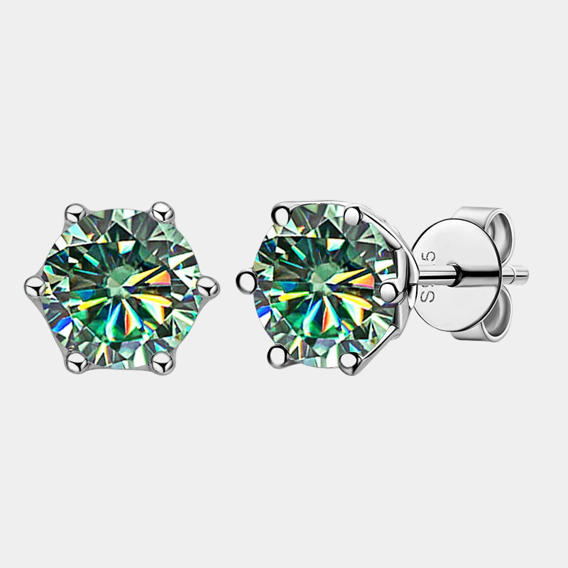 Pair of green gemstone stud earrings on a white background