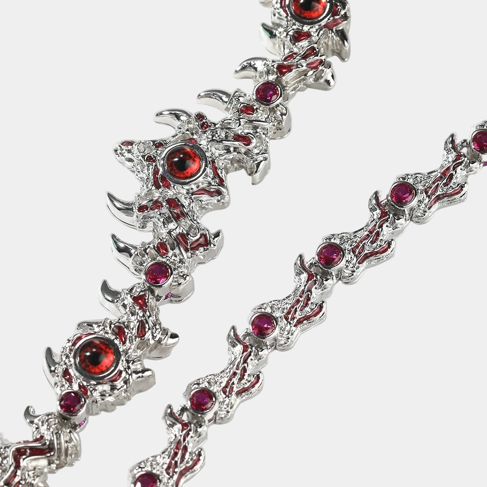 Silver bracelet with red gemstones on a white background