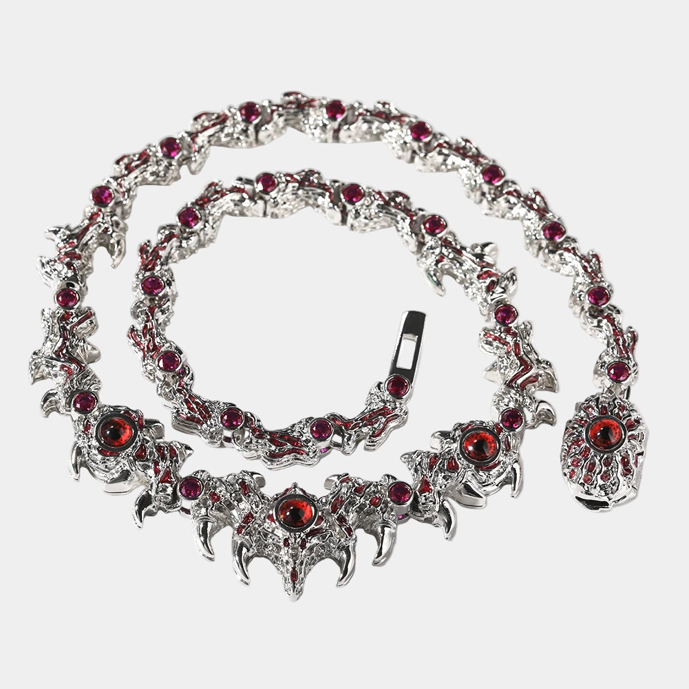 Silver bracelet with red gemstones on a white background