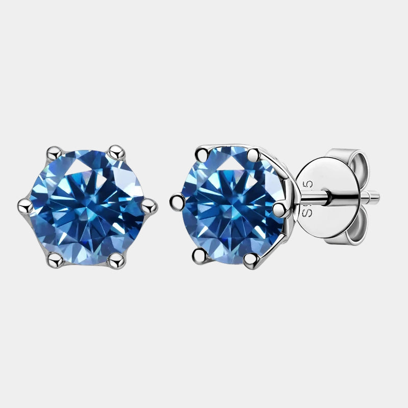 Pair of blue gemstone stud earrings on a white background