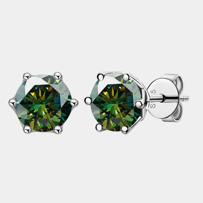 Green gemstone stud earrings on a white background