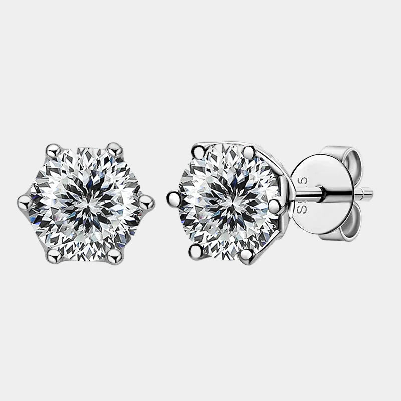 Pair of diamond stud earrings on a white background