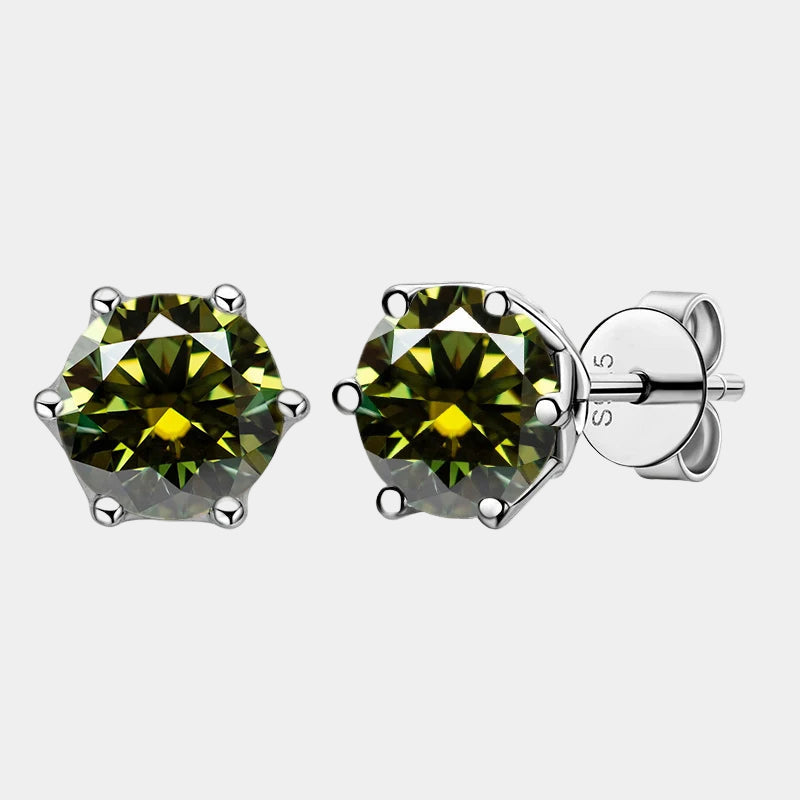 Green gemstone stud earrings on a white background